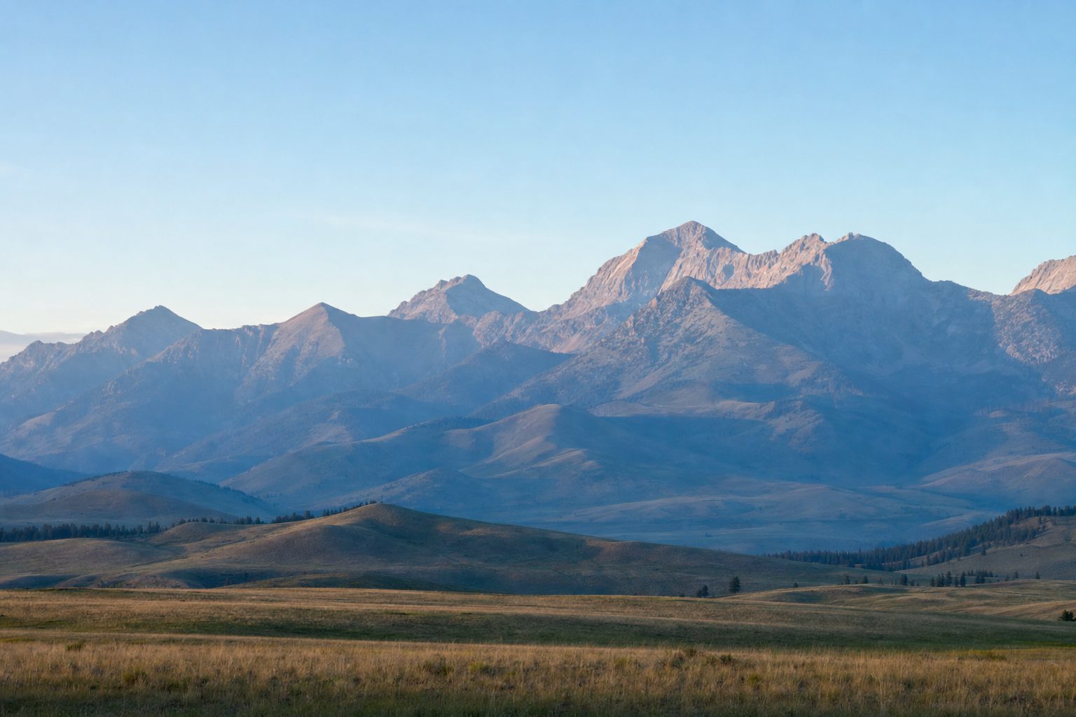 The Bridger Mountain Range at first light above open Montana foothills near Bozeman